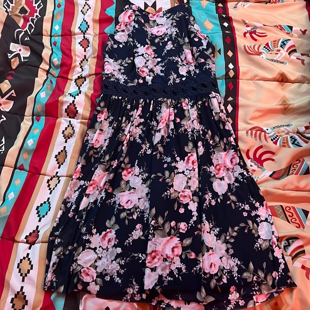 Navy blue dress with flower patterns all over